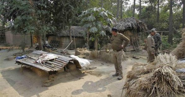 Indian police personnel inspect the area where a woman was gang-raped at Birbhum district in West Bengal