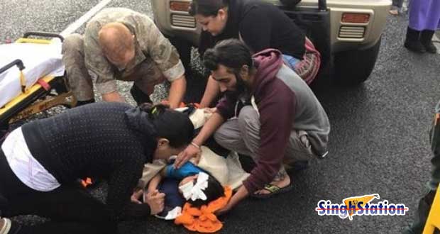 newzealand-sikh-removes-turban-help-child